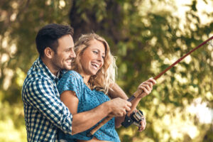 Photo of a Happy Couple along the Shore of One of the Quietest Whiteshell Fishing Spots.